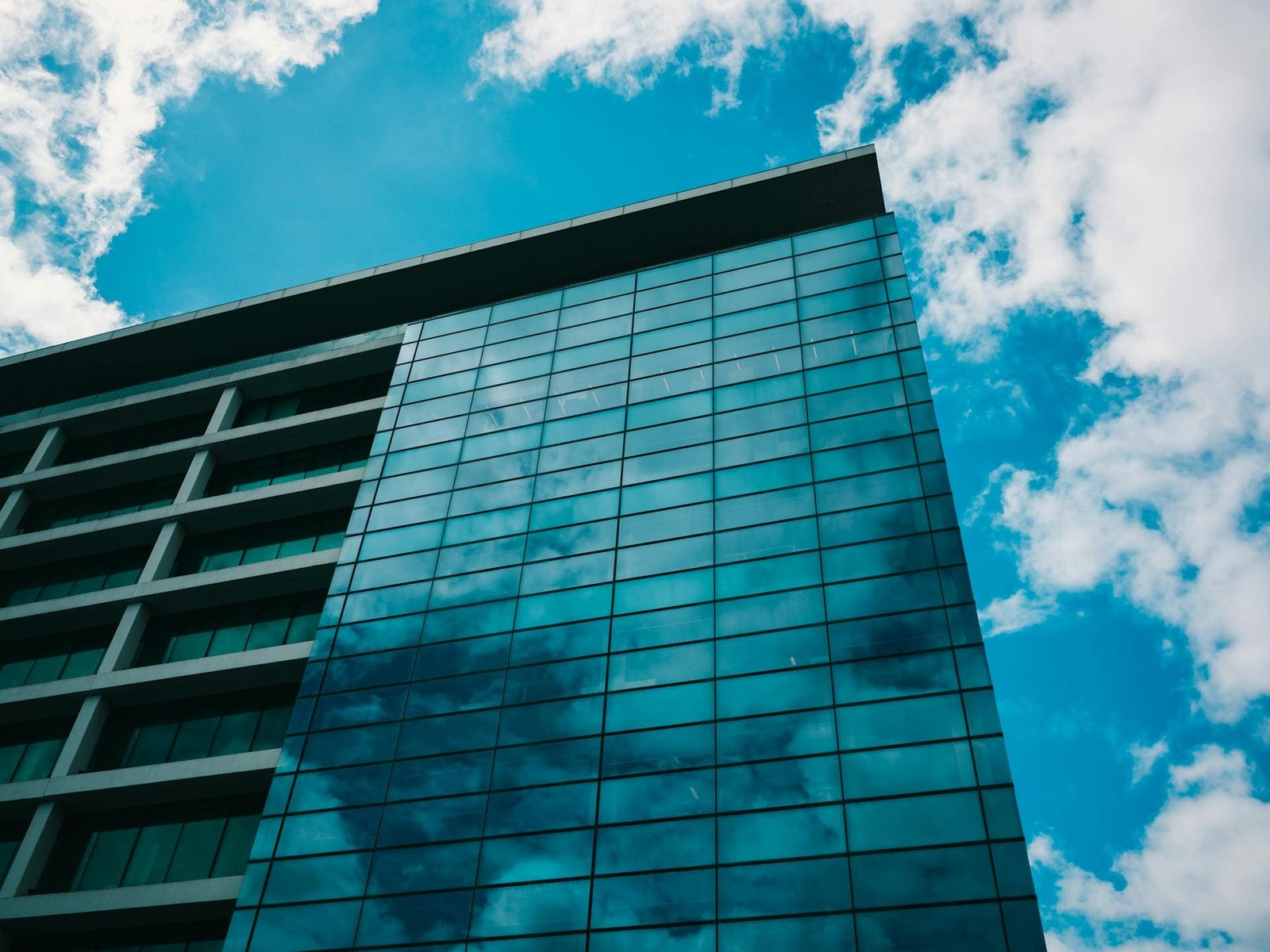 Modern commercial glass building with crystal-clear windows